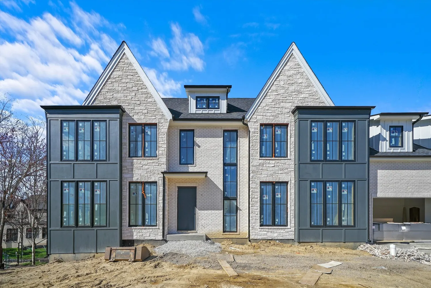 Susan Cook Homes — new-construction stone and brick home